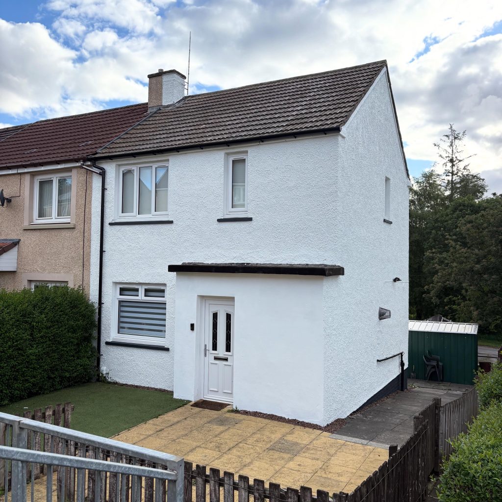 Exterior render cleaning on a residential home